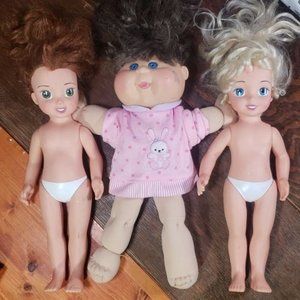 3 dolls one is a cabbage patch kids